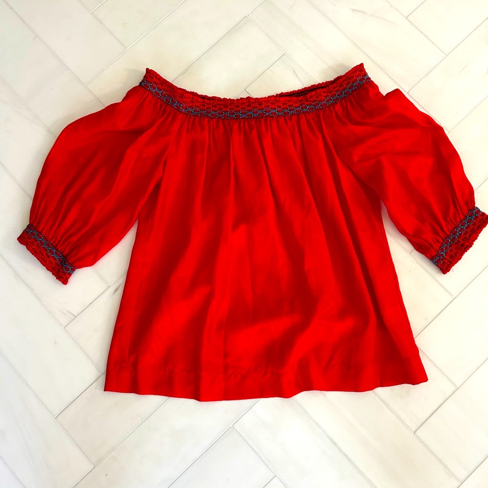 Trina Turk silk off the shoulder top with smocked blue and orange stitching!